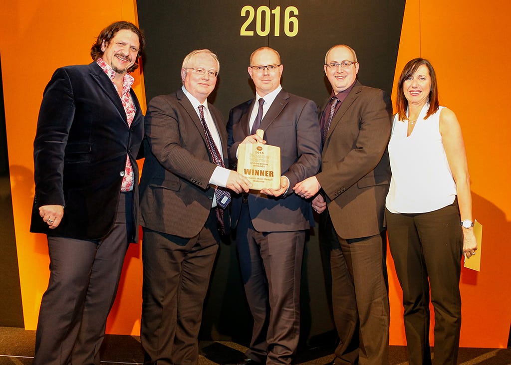 The Harts team accepting their award from Jay Rayner